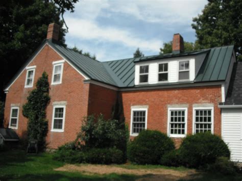 red metal roof on red brick house|brick homes with metal roofs.